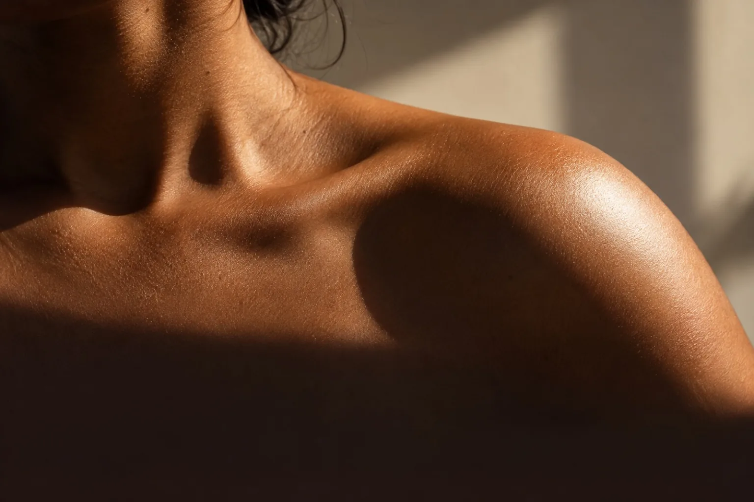 Sunlight across a bare shoulder